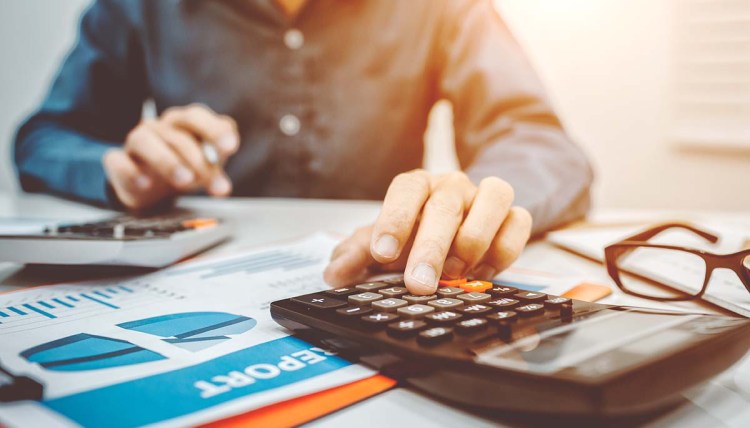 Young business man inspector in financial report.